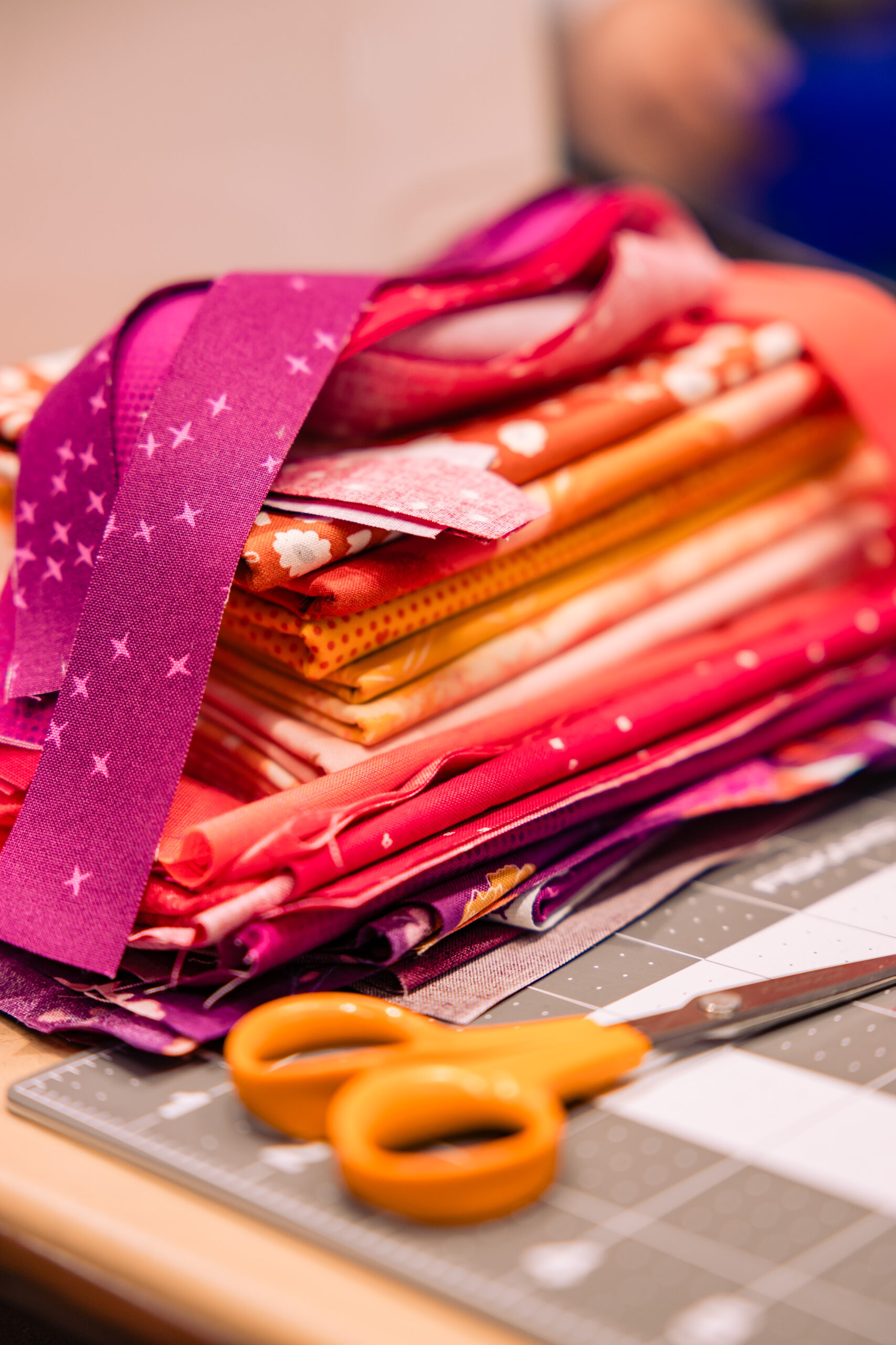 a stack of orange and pink fabric